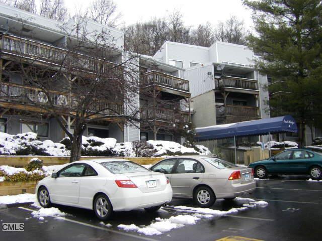 a view of cars parked in front of a building