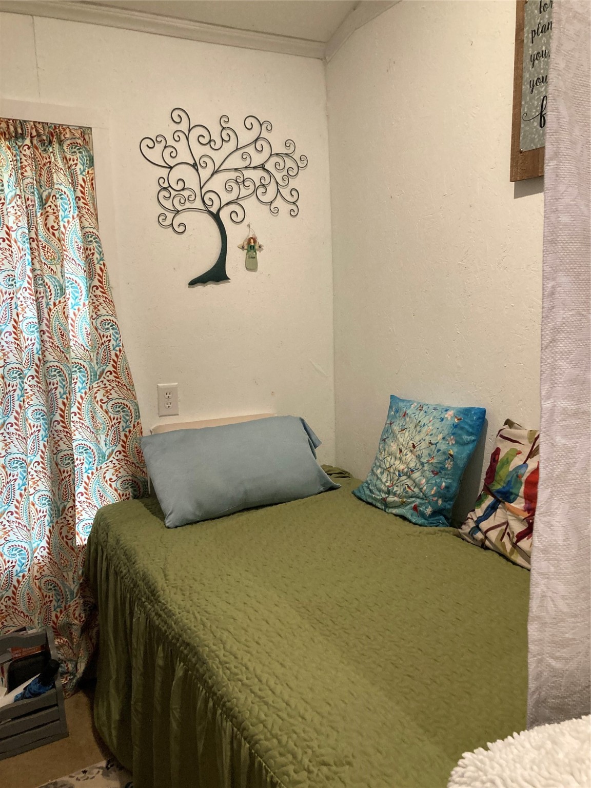 204 Knottypine Livingston, TX 77351 - Photo 20 of 30 a bed sitting in a bedroom next to a white wall