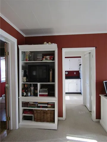 a living room with washer and dryer