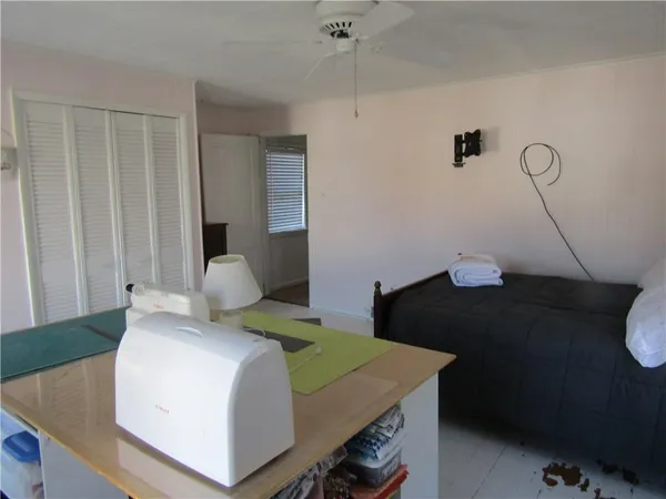 a bedroom with a bed and a table