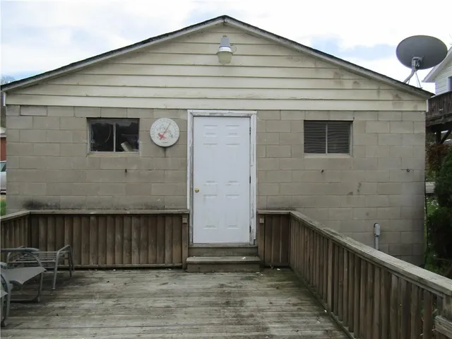 a front view of a house with wooden fence