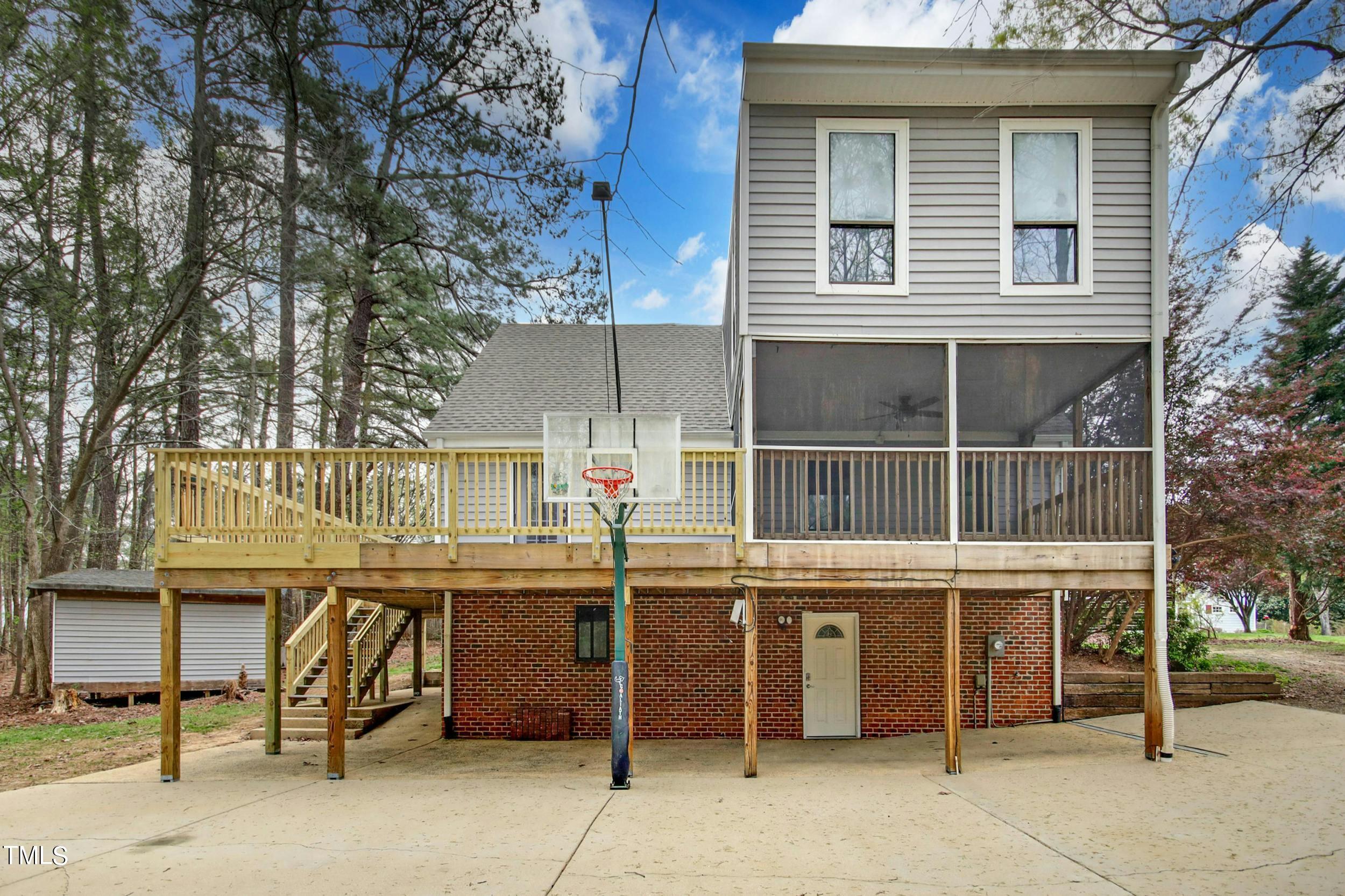 2609 Carpenter Pond Road Raleigh, NC 27613 - Photo 1 of 33 a view of a house with a backyard
