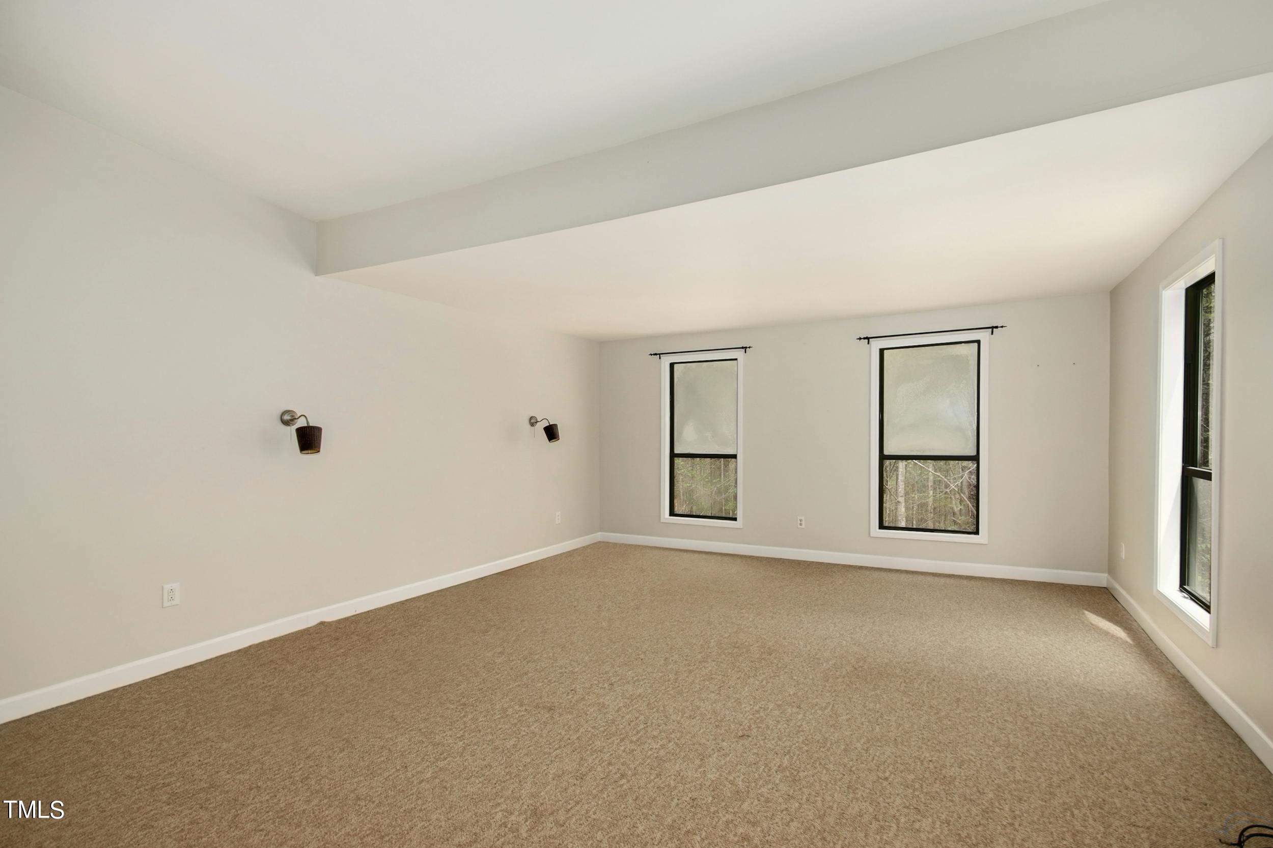 2609 Carpenter Pond Road Raleigh, NC 27613 - Photo 18 of 33 an empty room with windows
