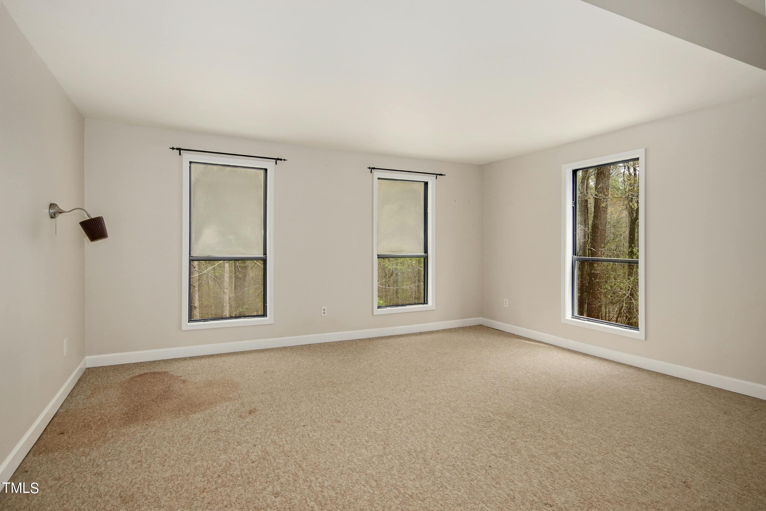 2609 Carpenter Pond Road Raleigh, NC 27613 - Photo 19 of 33 an empty room with windows and closet