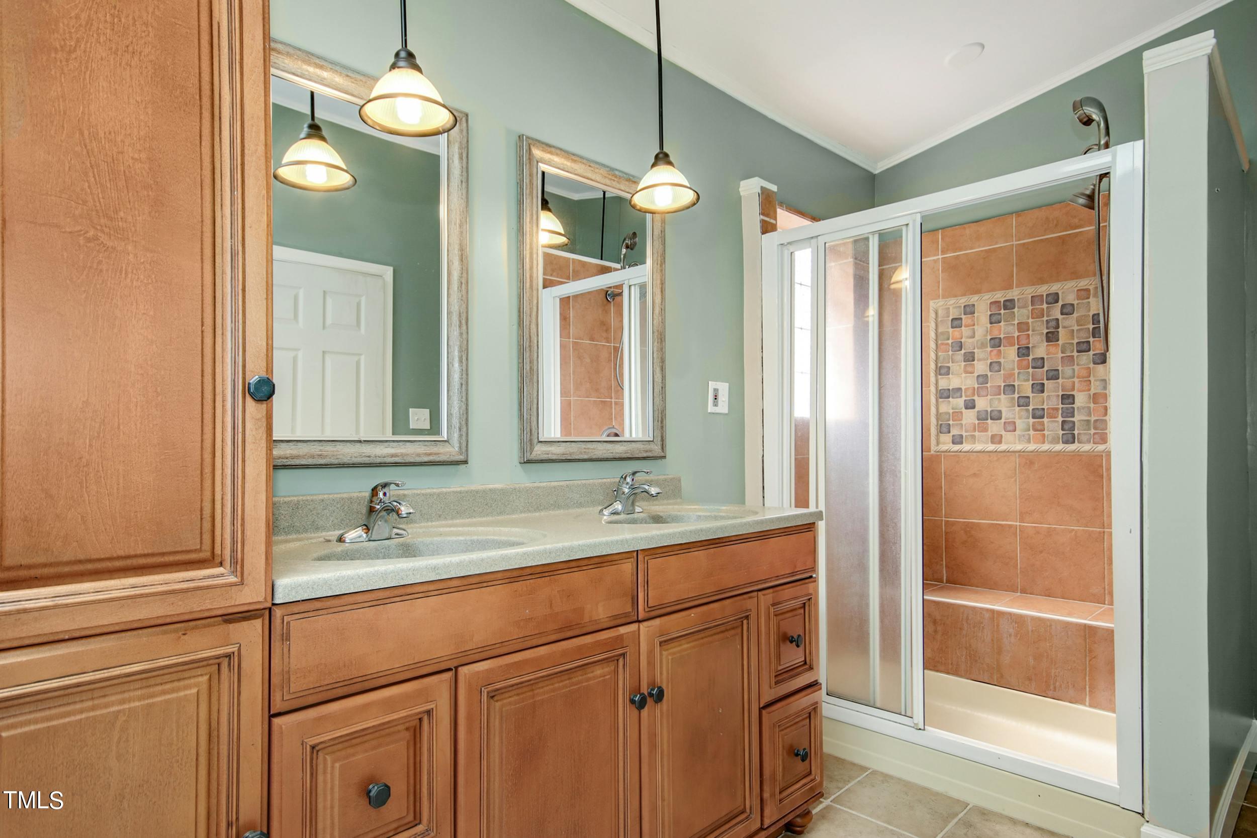2609 Carpenter Pond Road Raleigh, NC 27613 - Photo 22 of 33 a bathroom with a double vanity sink mirror and double