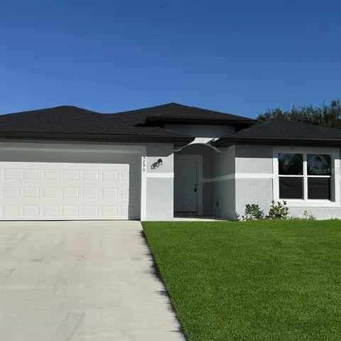 a kitchen with stainless steel appliances granite countertop a stove a refrigerator and a sink