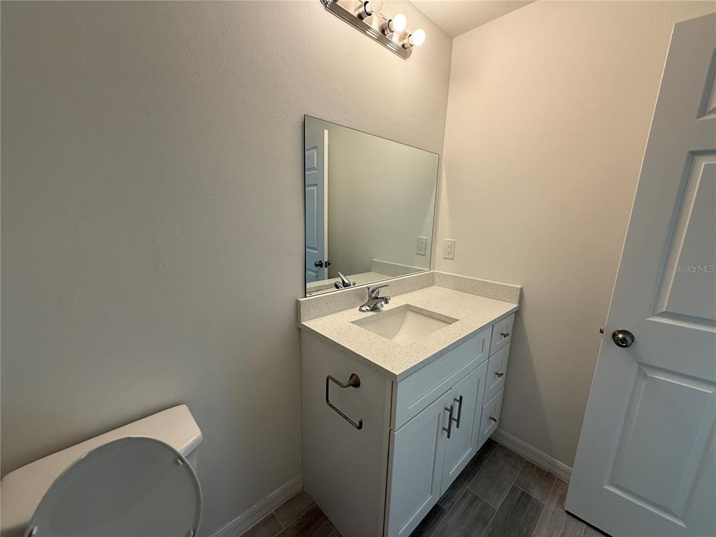 5290 Arley Road North Port, FL 34288 - Photo 16 of 26 a view of bathroom with a sink and a mirror