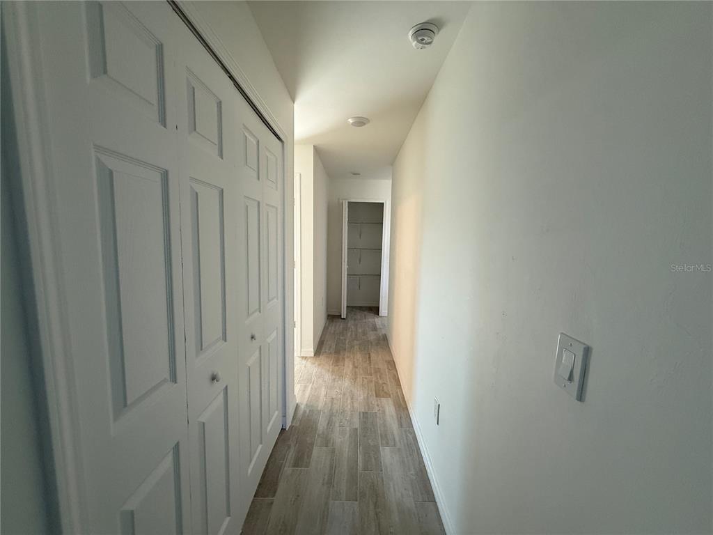 5290 Arley Road North Port, FL 34288 - Photo 19 of 26 a view of a hallway with wooden floor