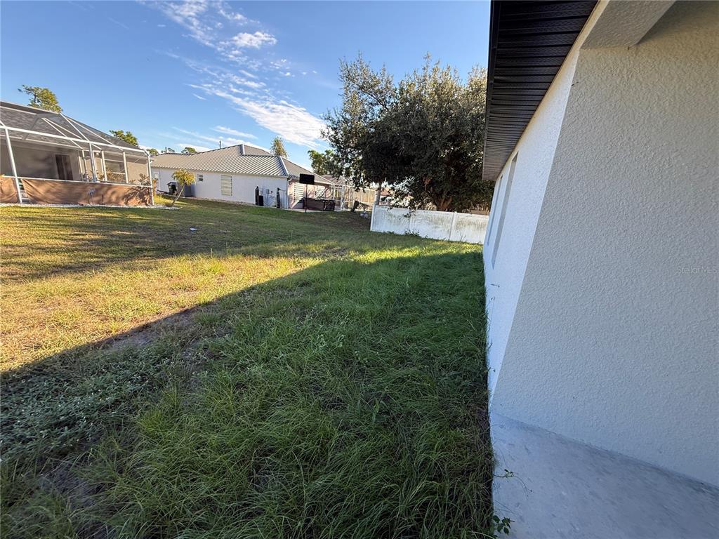 5290 Arley Road North Port, FL 34288 - Photo 24 of 26 a view of a house with a yard