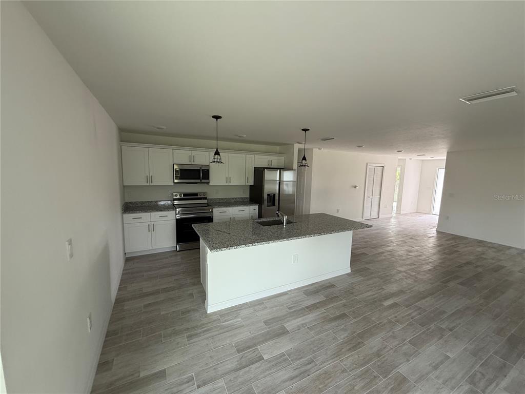 5290 Arley Road North Port, FL 34288 - Photo 7 of 26 a view of kitchen with sink and refrigerator