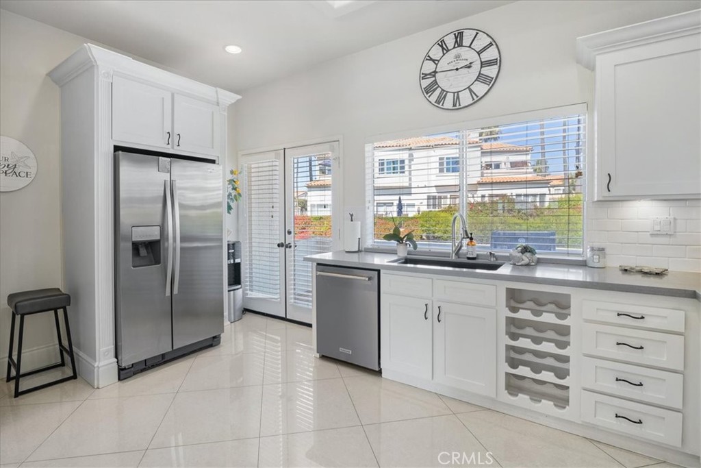 17 Centre Court Dana Point, CA 92629 - Photo 13 of 45 a kitchen with stainless steel appliances granite countertop a refrigerator and a stove