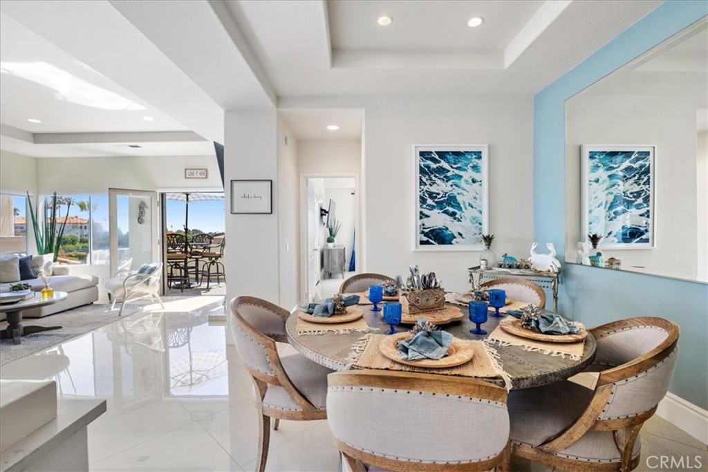 17 Centre Court Dana Point, CA 92629 - Photo 17 of 45 a dining room with furniture and a large window