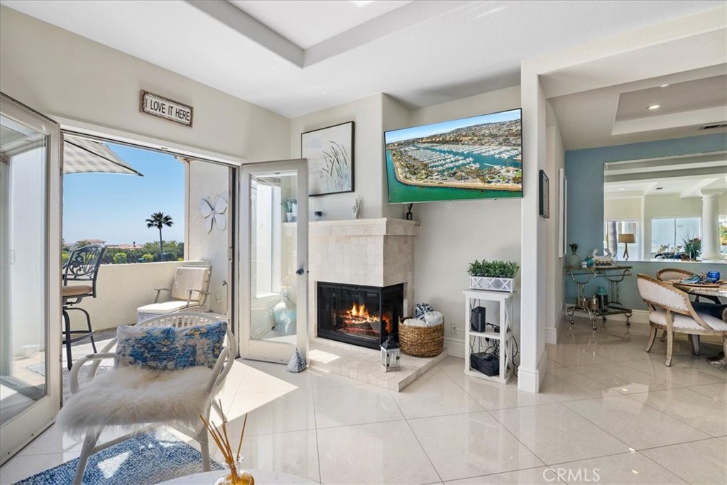 17 Centre Court Dana Point, CA 92629 - Photo 6 of 45 a living room with furniture and a fireplace
