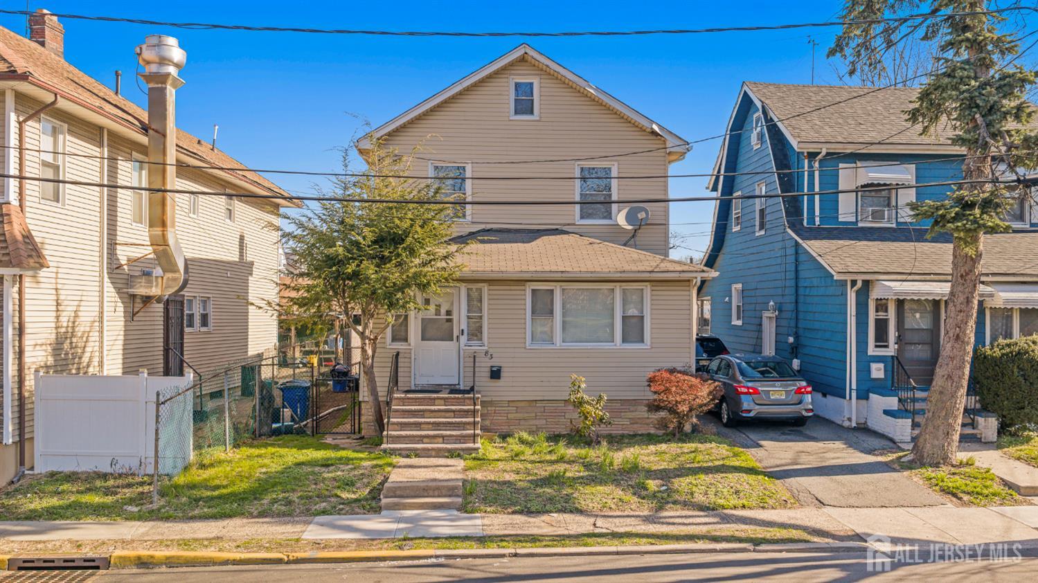 83 May Street Irvington, NJ 07111 - Photo 1 of 27 a front view of a house with garden