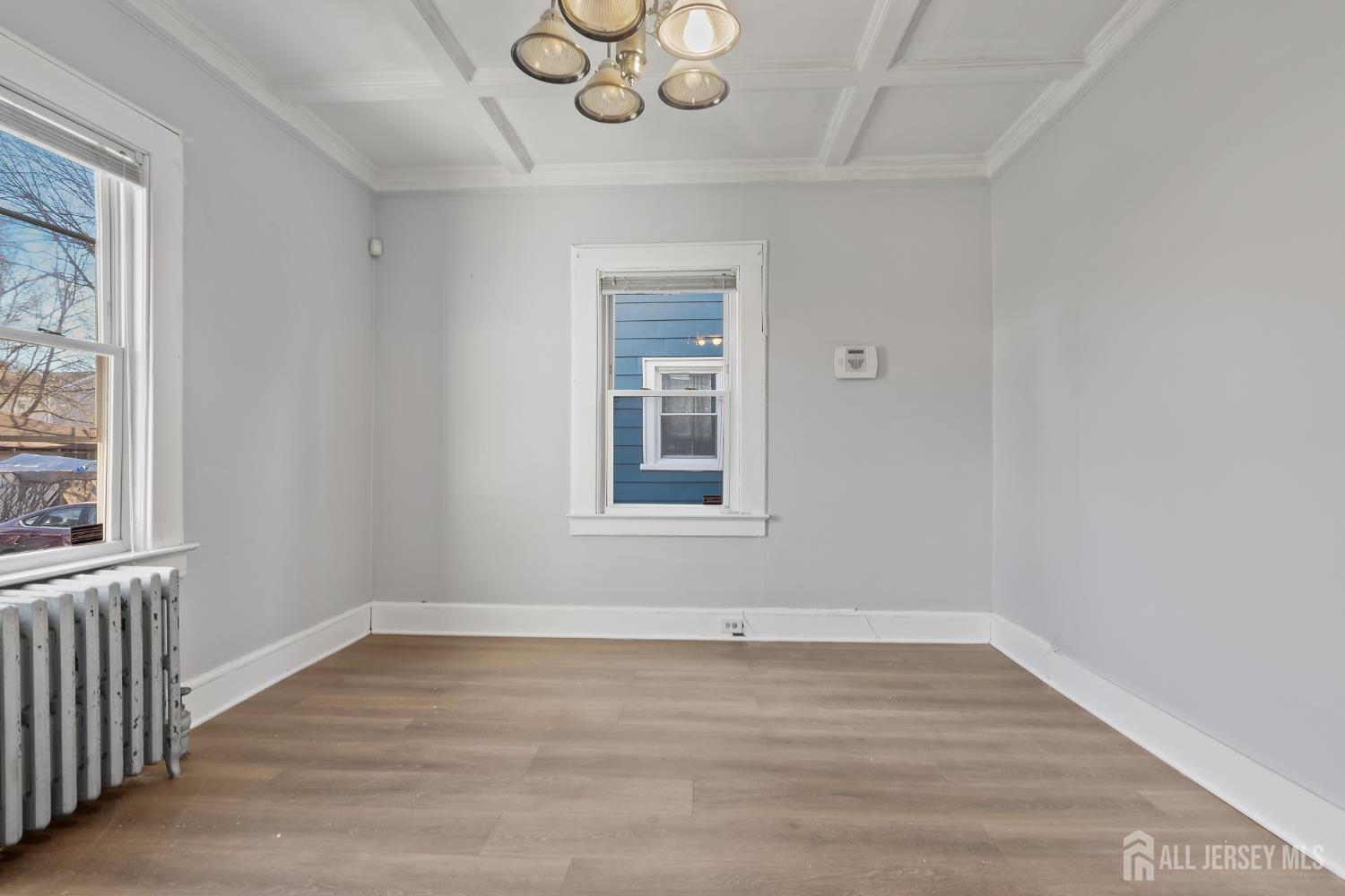 83 May Street Irvington, NJ 07111 - Photo 15 of 27 a view of a room with wooden floor and windows