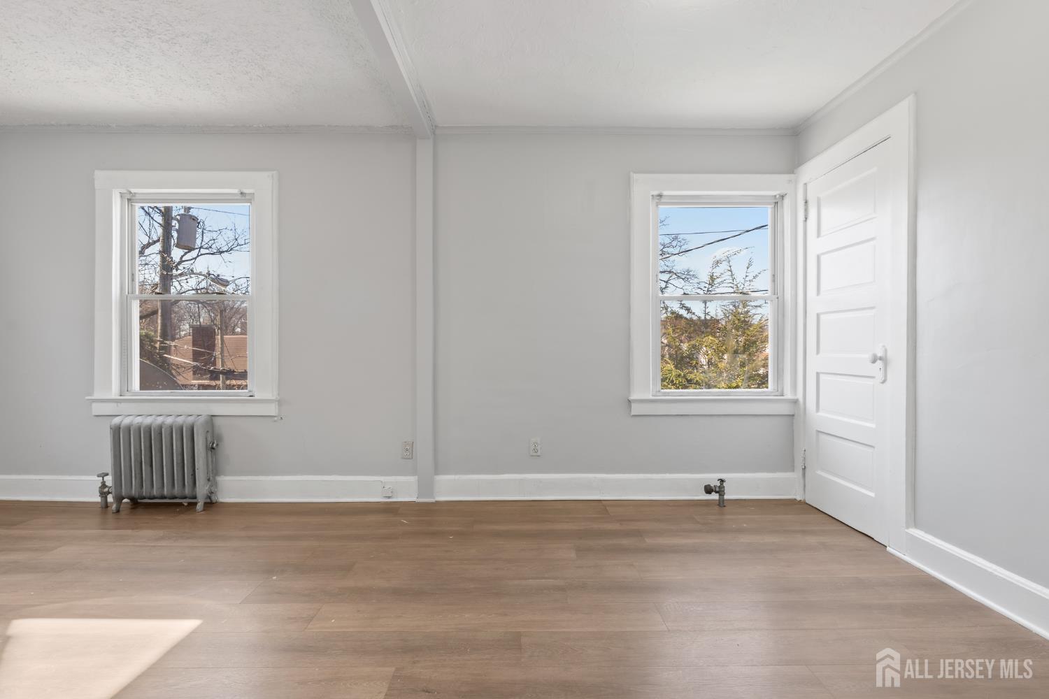 83 May Street Irvington, NJ 07111 - Photo 19 of 27 an empty room with windows