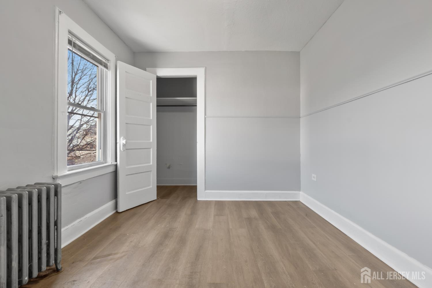 83 May Street Irvington, NJ 07111 - Photo 20 of 27 an empty room with windows