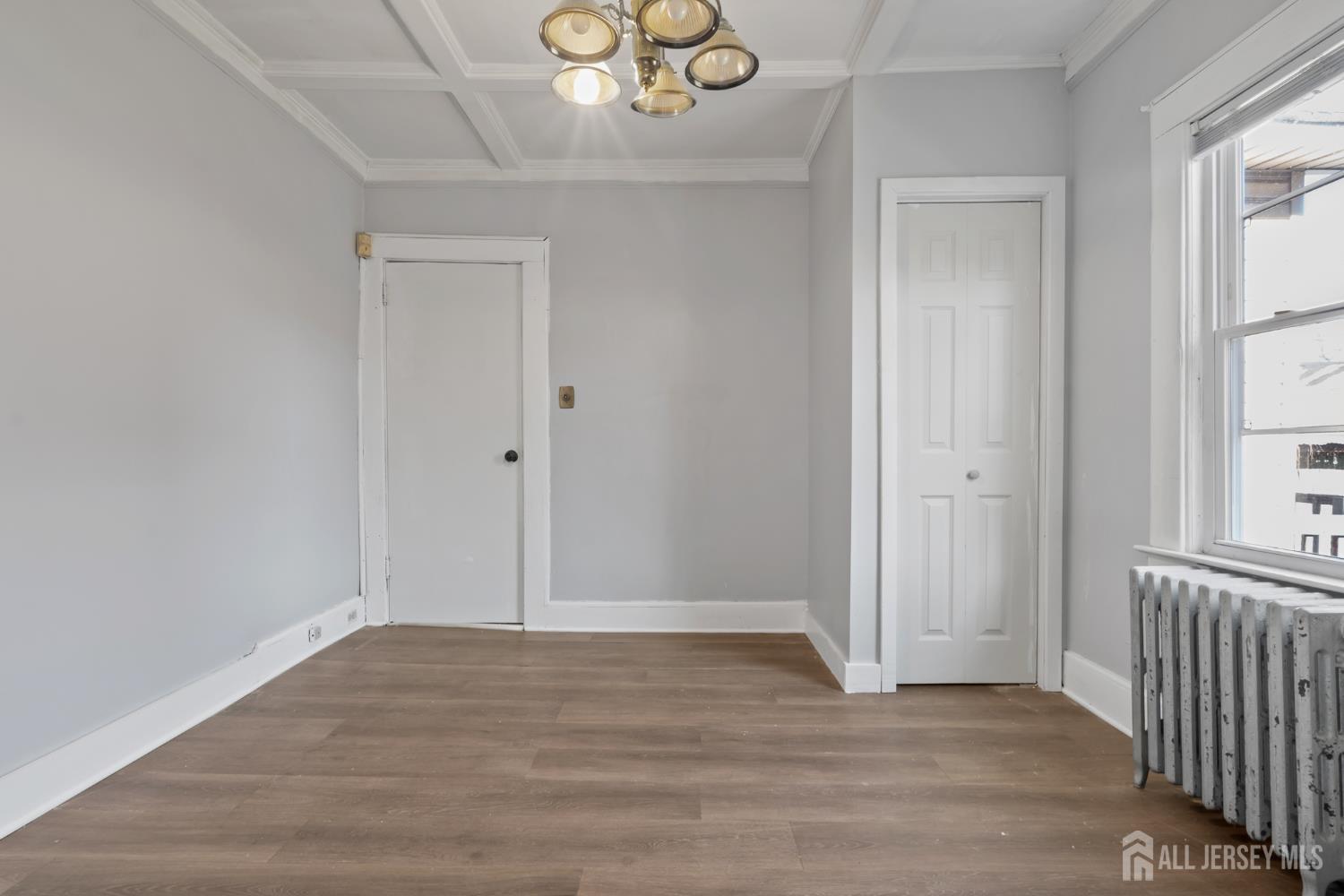 83 May Street Irvington, NJ 07111 - Photo 7 of 27 a view of empty room with wooden floor