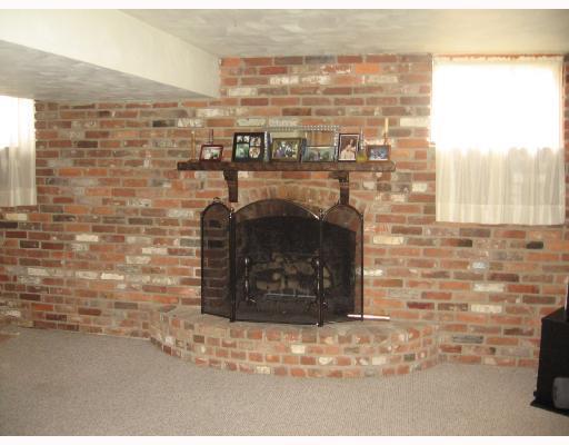 2607 Reiter Road Penn Hills, PA 15235 - Photo 10 of 18 Den/Family/Great Room. INVITING FIREPLACE SET IN THIS ATTRACTIVE EXPOSED BRICK ACCENT WALL.