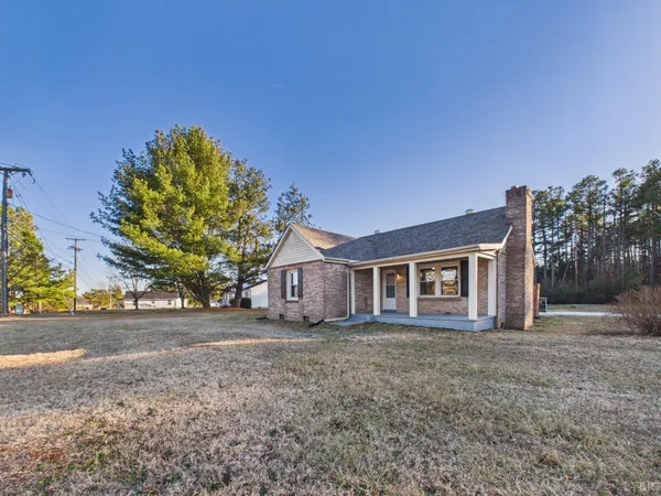 front view of a house with a tree