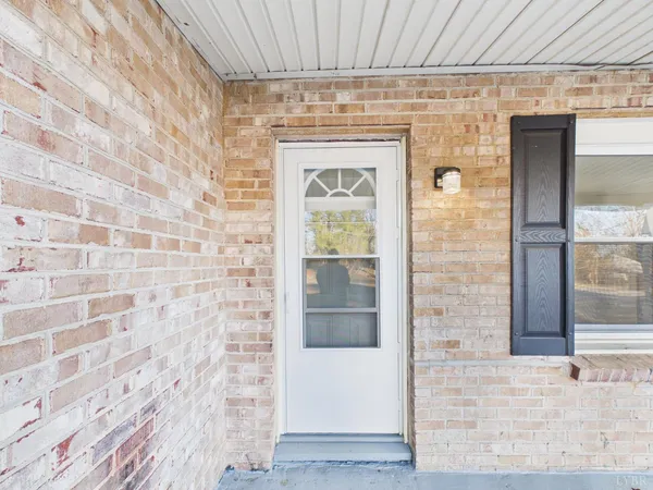 a front view of a brick house with a glass door