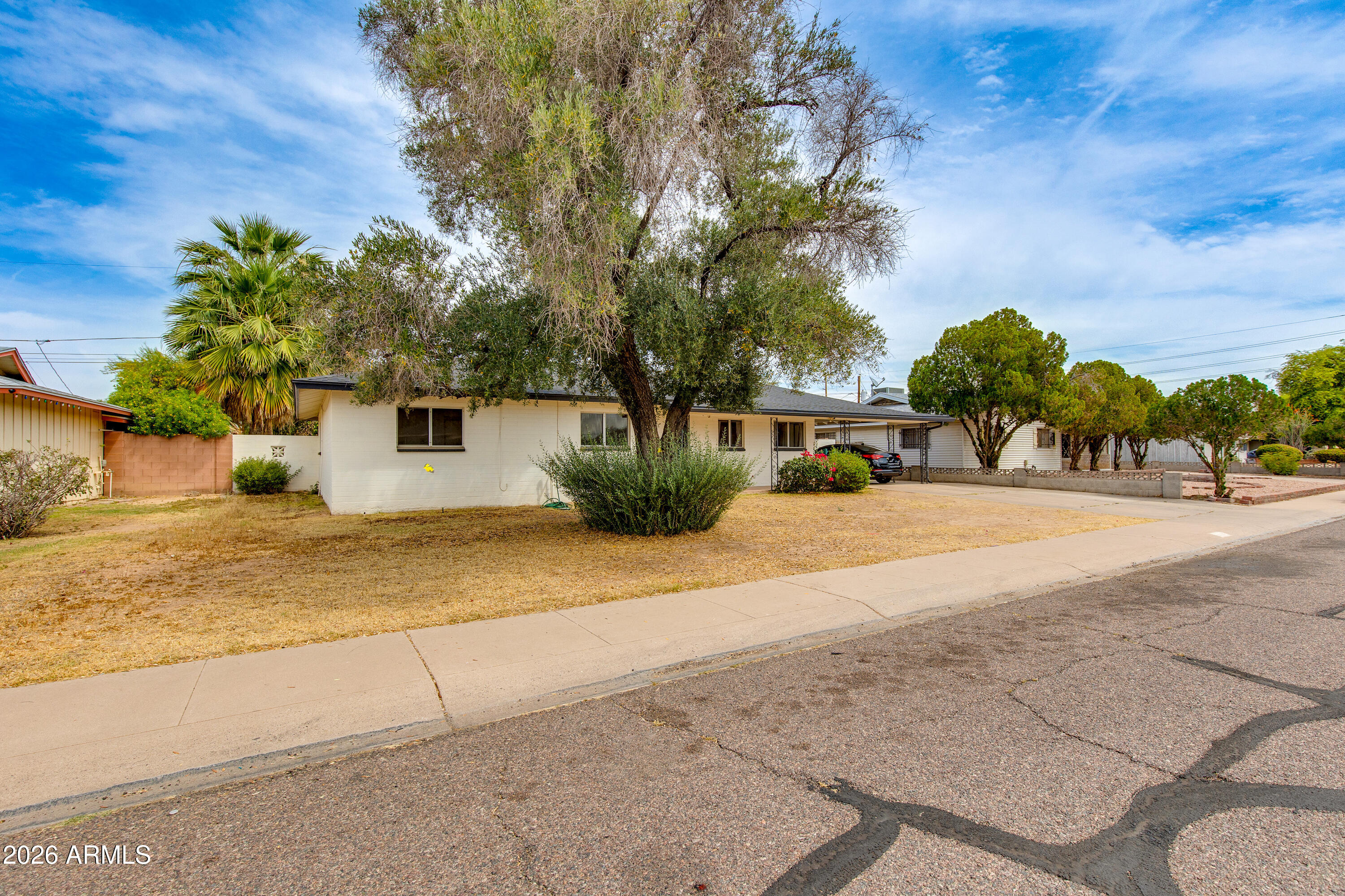 1524 West Ocotillo Road Phoenix, AZ 85015 - Photo 2 of 29 a view of road and trees