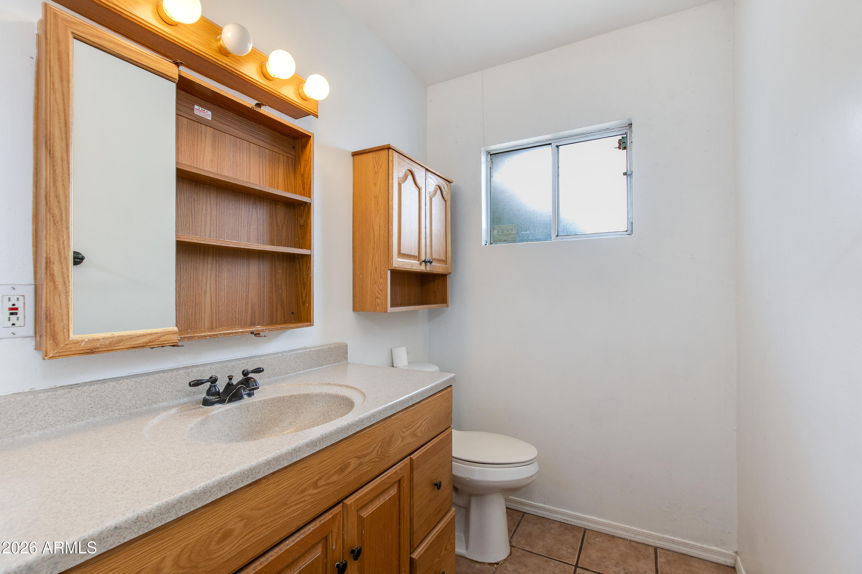 1524 West Ocotillo Road Phoenix, AZ 85015 - Photo 22 of 29 a bathroom with a sink and a toilet