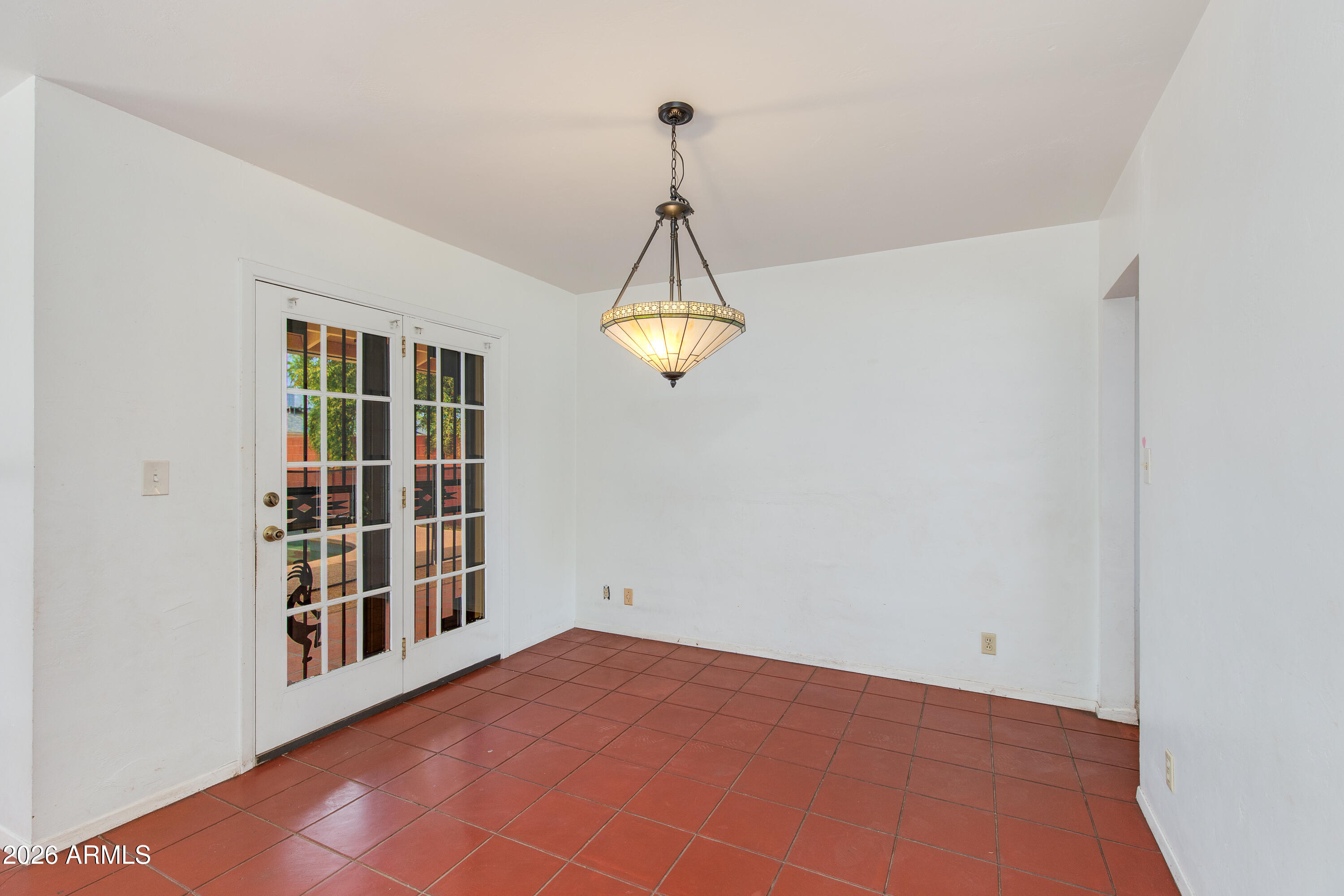 1524 West Ocotillo Road Phoenix, AZ 85015 - Photo 10 of 29 a view of an empty room with a window