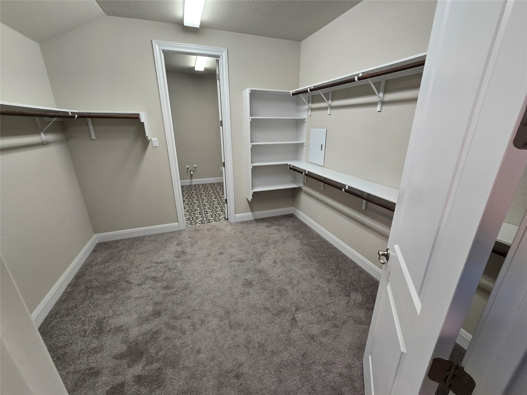 539 Tanda Lane Hutto, TX 78634 - Photo 11 of 18 a view of walk in closet with empty racks