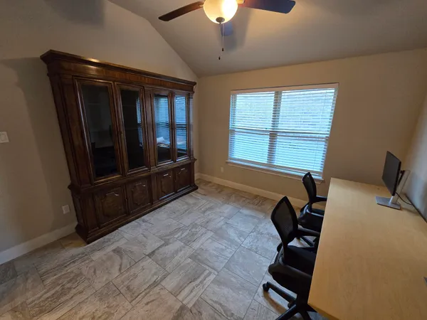 a bed room with furniture and a window
