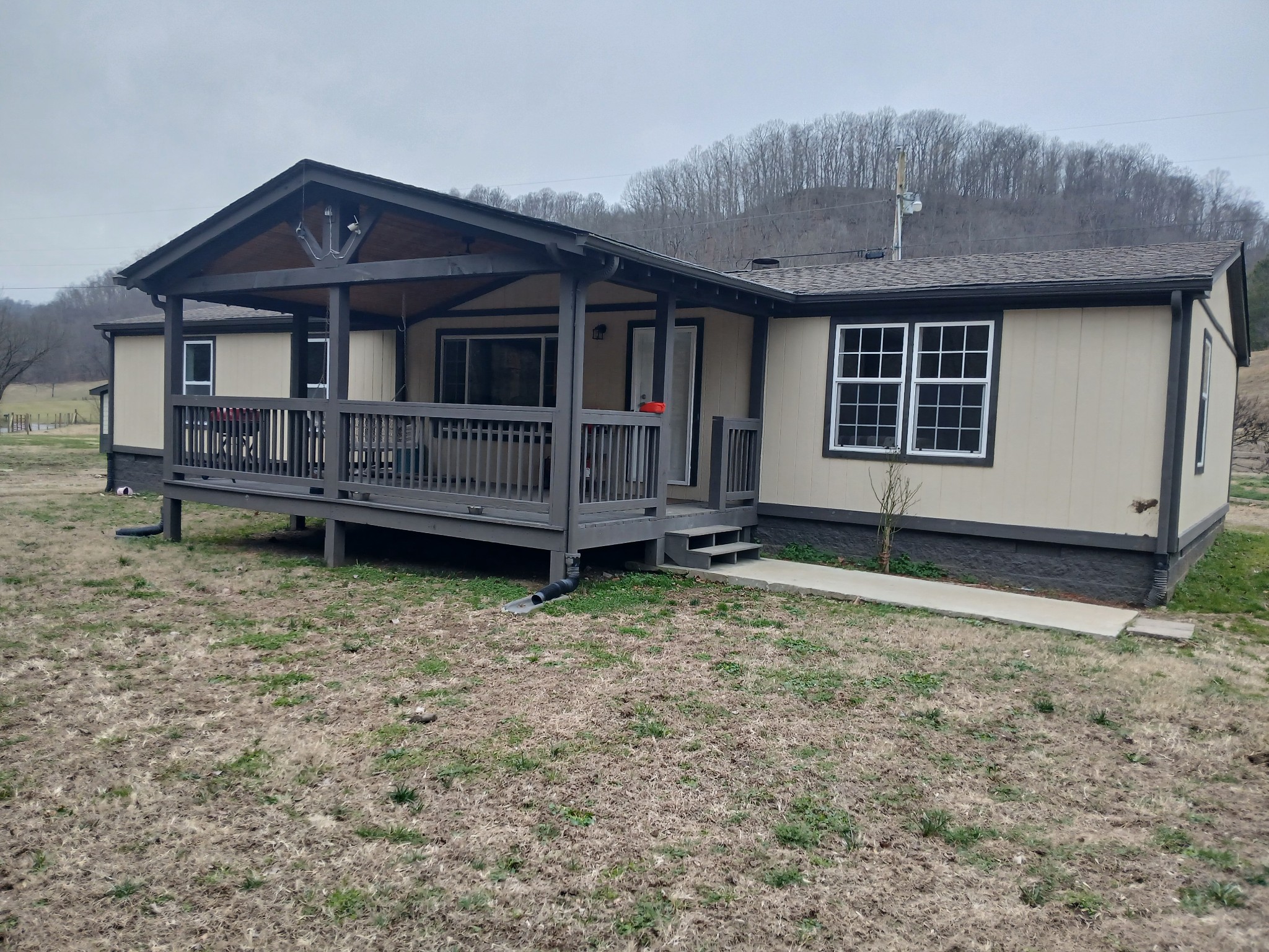 655 Wilmore Hollow Road Pleasant Shade, TN 37145 - Photo 2 of 47 a front view of a house with a yard
