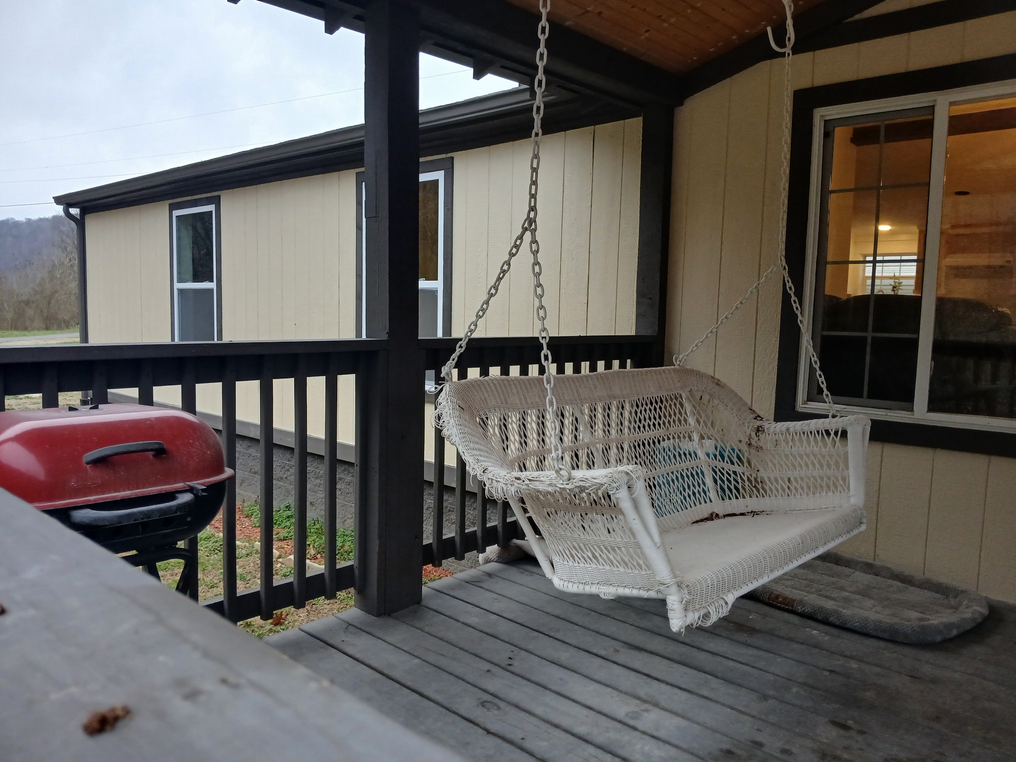 655 Wilmore Hollow Road Pleasant Shade, TN 37145 - Photo 33 of 47 a view of a porch with wooden floor and furniture