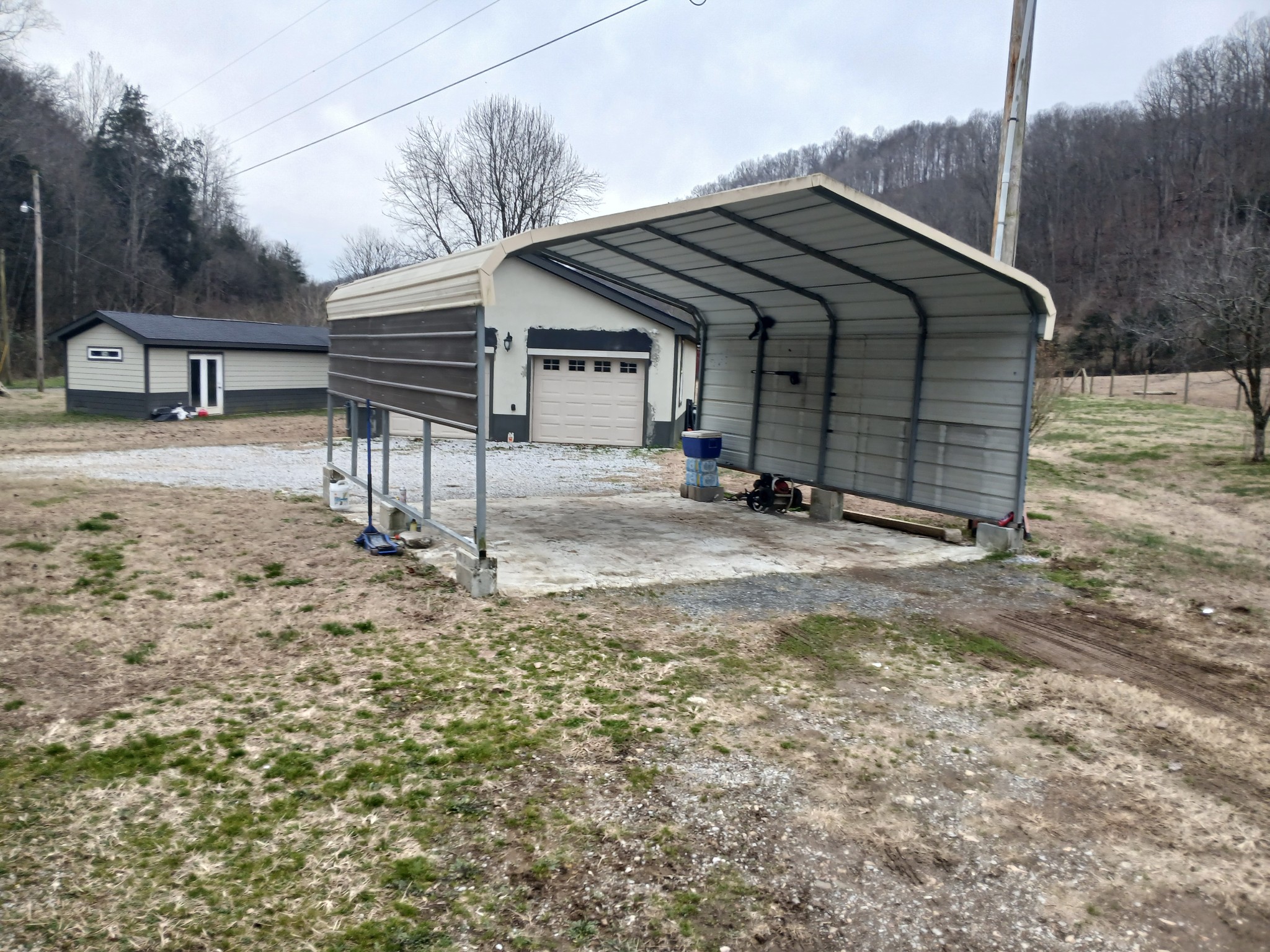 655 Wilmore Hollow Road Pleasant Shade, TN 37145 - Photo 44 of 47 a backyard of a house with table and chairs