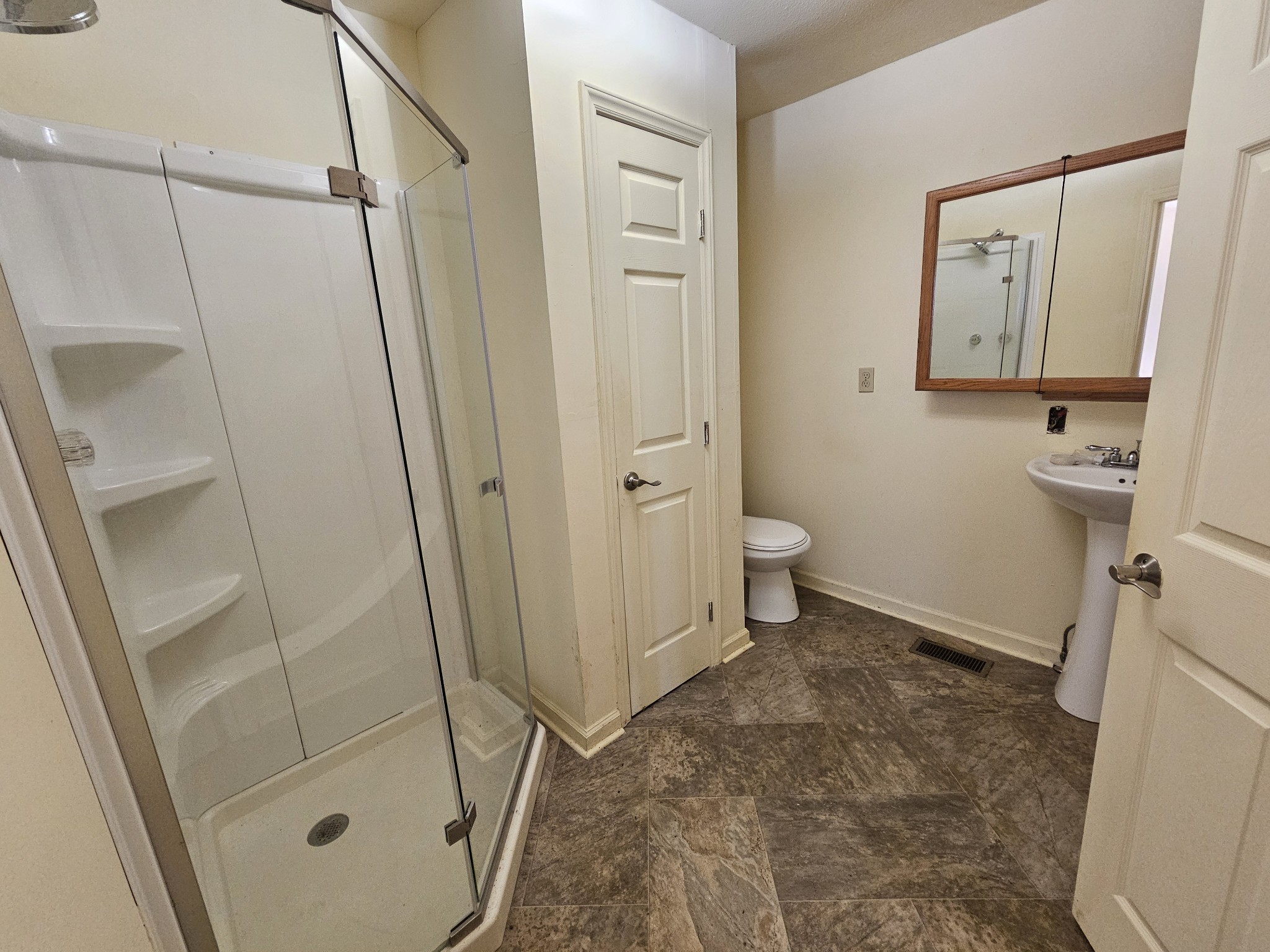 105 East Market Street Decherd, TN 37324 - Photo 11 of 12 a bathroom with a granite countertop sink toilet and shower