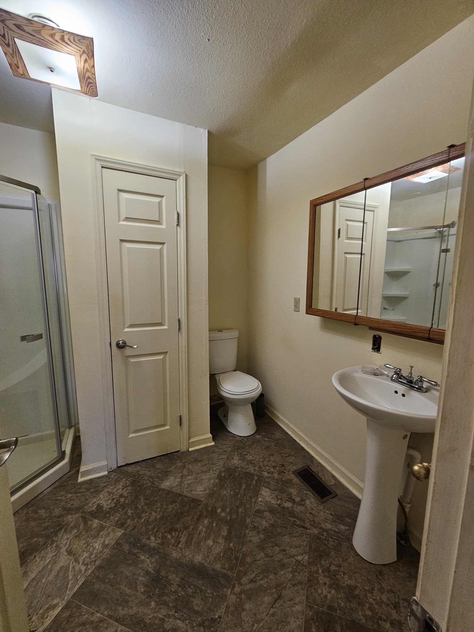 105 East Market Street Decherd, TN 37324 - Photo 12 of 12 a bathroom with a toilet sink and mirror
