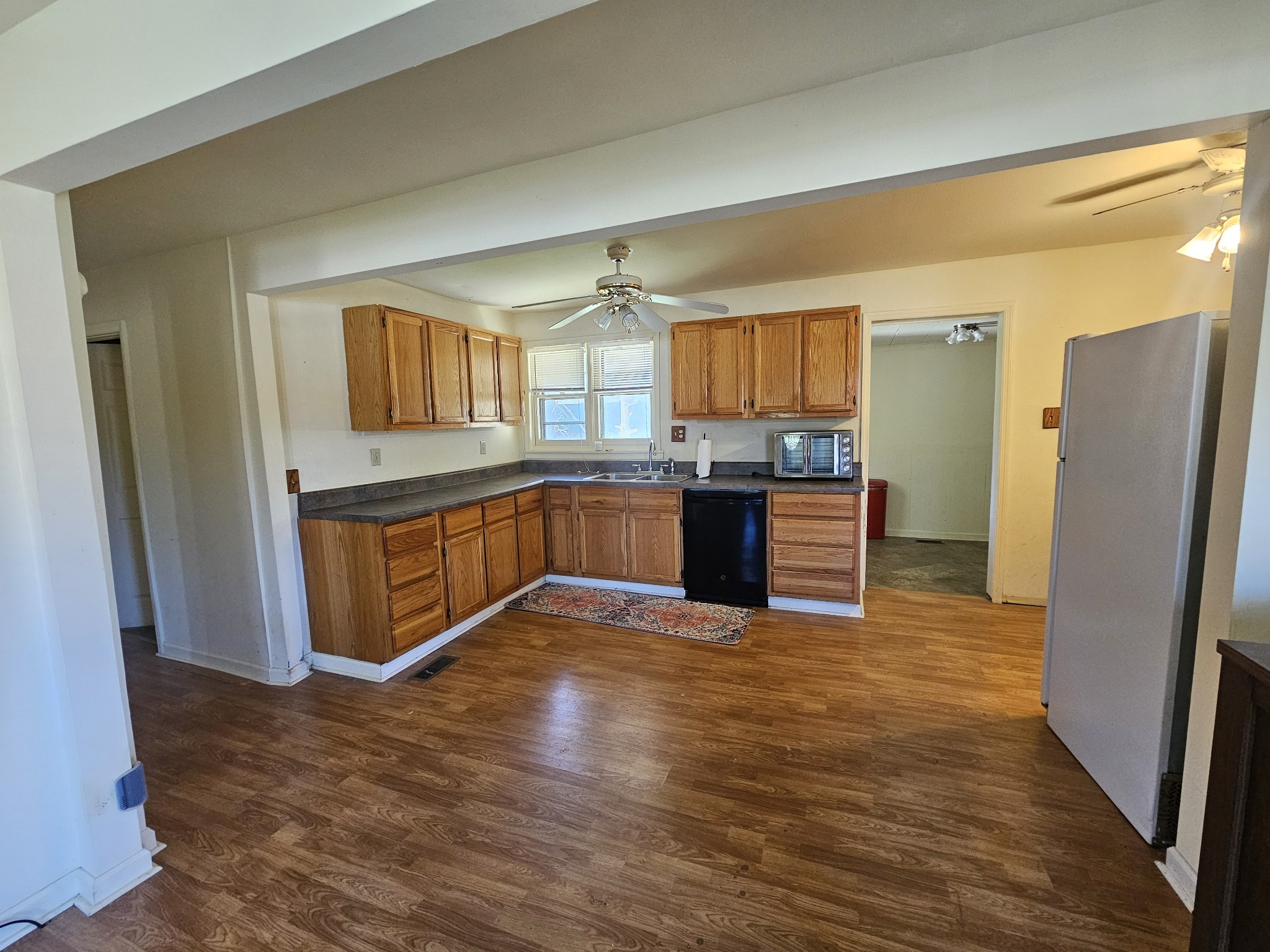 105 East Market Street Decherd, TN 37324 - Photo 4 of 12 a kitchen with stainless steel appliances granite countertop a refrigerator a stove and a sink