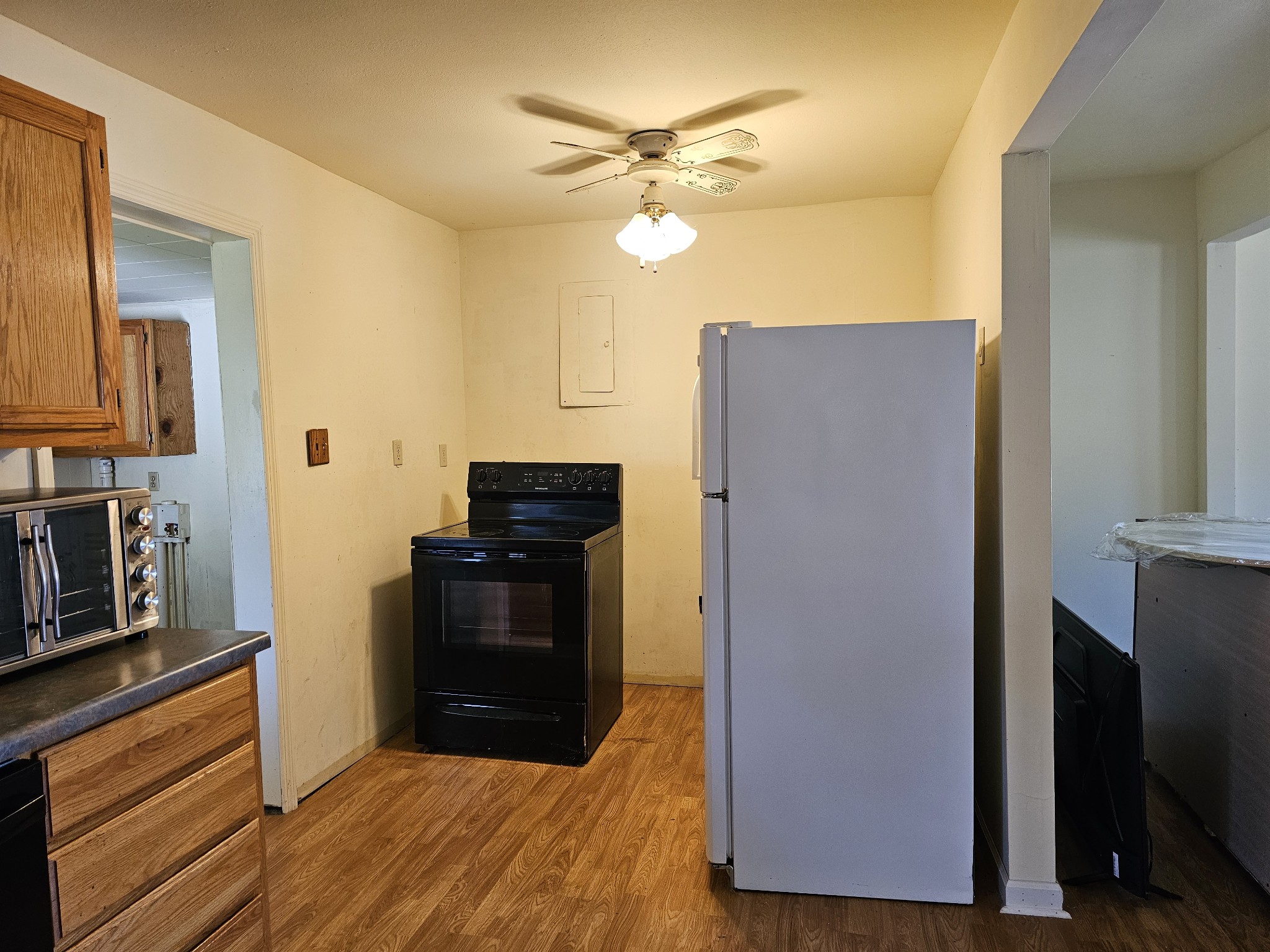 105 East Market Street Decherd, TN 37324 - Photo 5 of 12 a kitchen with a refrigerator and a stove top oven