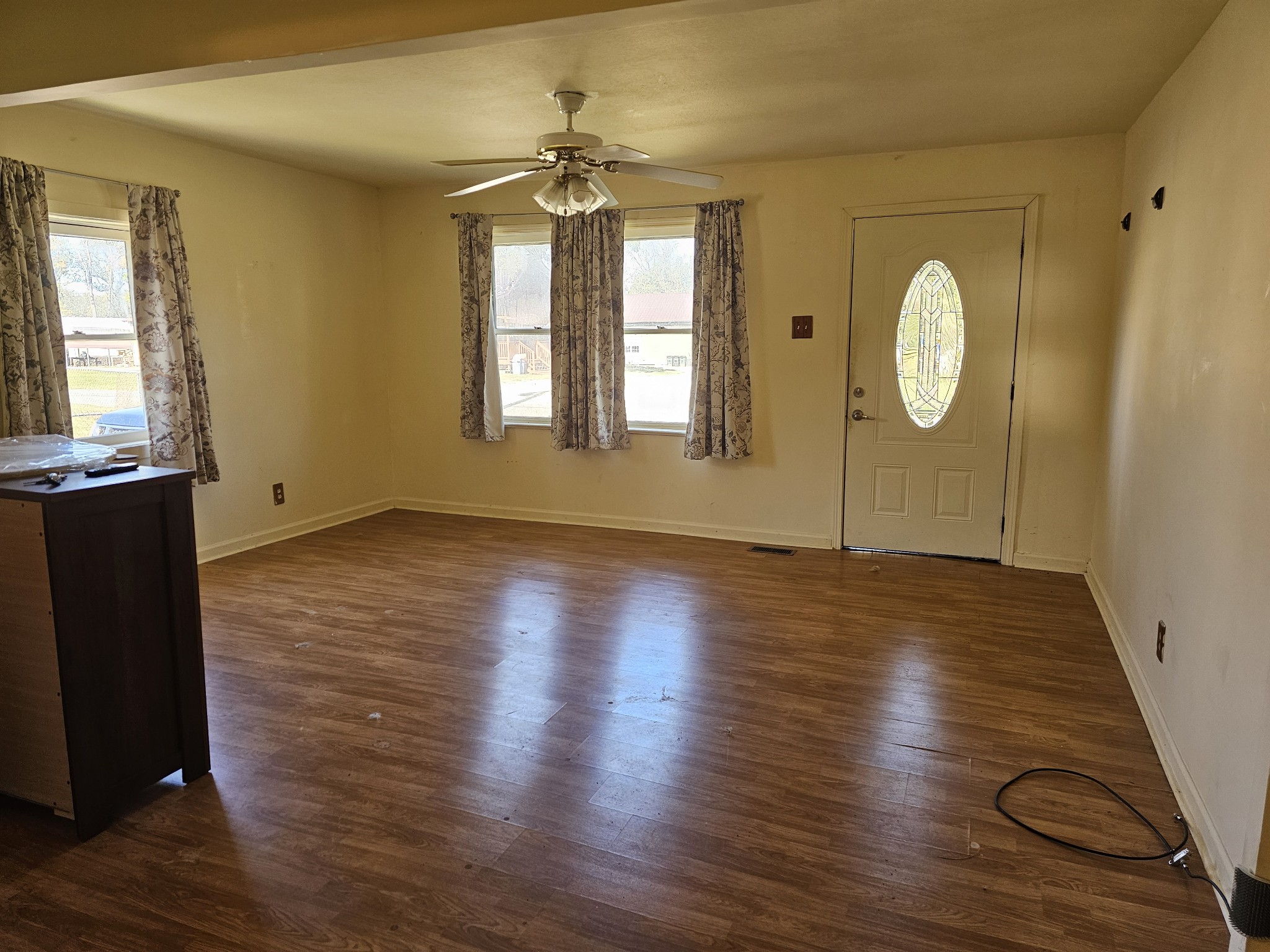 105 East Market Street Decherd, TN 37324 - Photo 6 of 12 a view of room with window and wooden floor