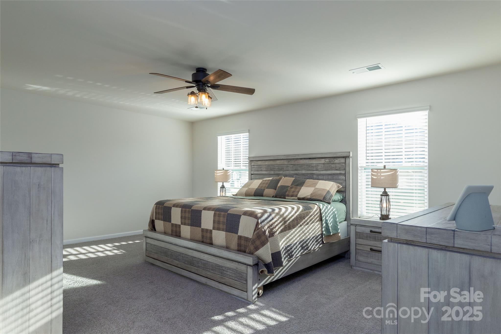 84 Madelyn Drive Clyde, NC 28721 - Photo 13 of 29 a bedroom with a bed couch and window