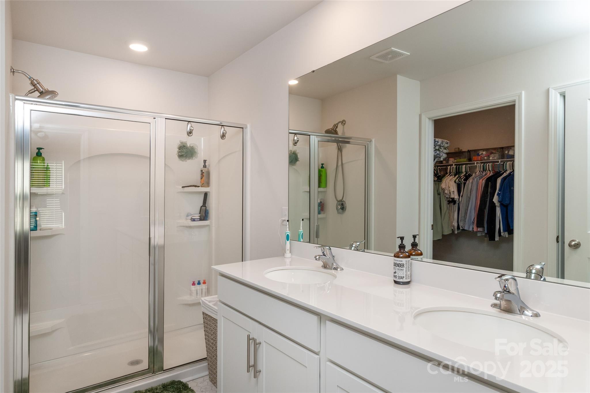 84 Madelyn Drive Clyde, NC 28721 - Photo 14 of 29 a bathroom with a granite countertop sink mirror shower and double