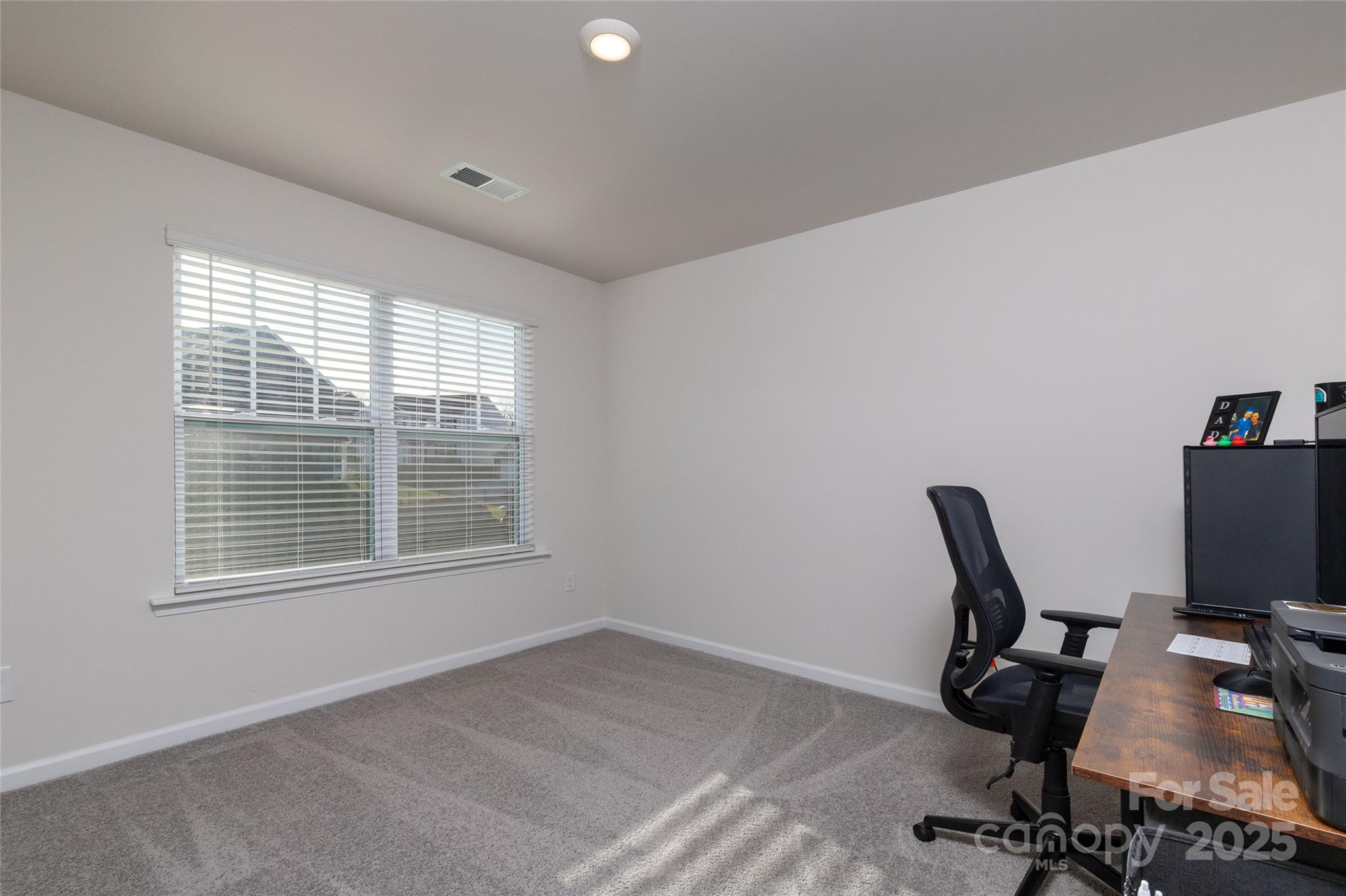 84 Madelyn Drive Clyde, NC 28721 - Photo 17 of 29 a view of a workspace with furniture and a window
