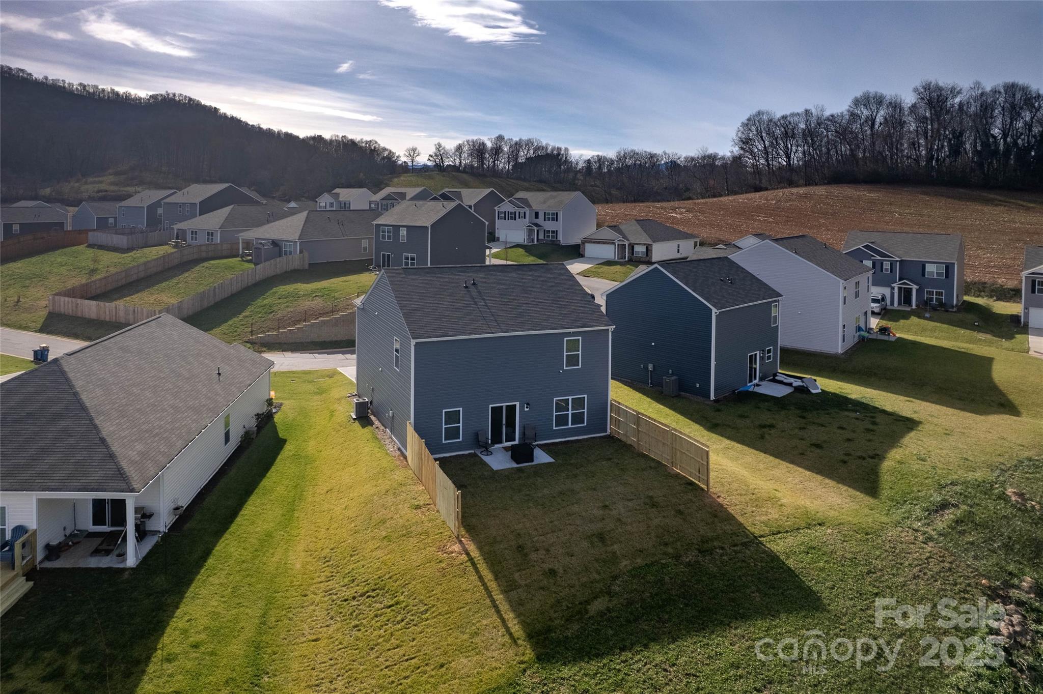 84 Madelyn Drive Clyde, NC 28721 - Photo 24 of 29 an aerial view of a house with a garden and lake view