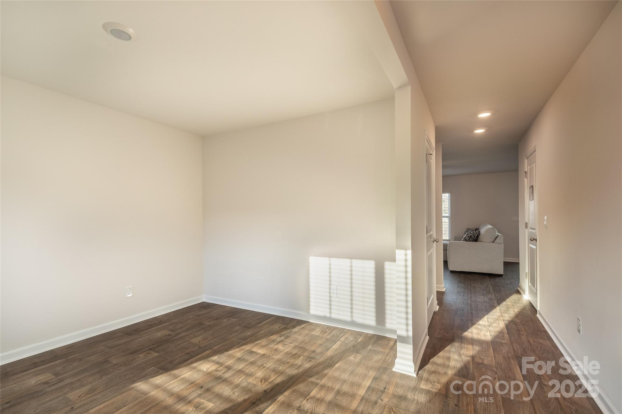 84 Madelyn Drive Clyde, NC 28721 - Photo 6 of 29 a view of an empty room and a bedroom