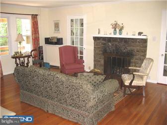 309 South Chester Road Swarthmore, PA 19081 - Photo 2 of 8 a living room with furniture a window and a fireplace