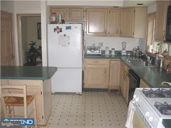 309 South Chester Road Swarthmore, PA 19081 - Photo 4 of 8 a kitchen with a refrigerator a stove a sink and a stove