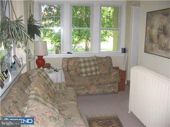309 South Chester Road Swarthmore, PA 19081 - Photo 5 of 8 a living room with furniture and a large window
