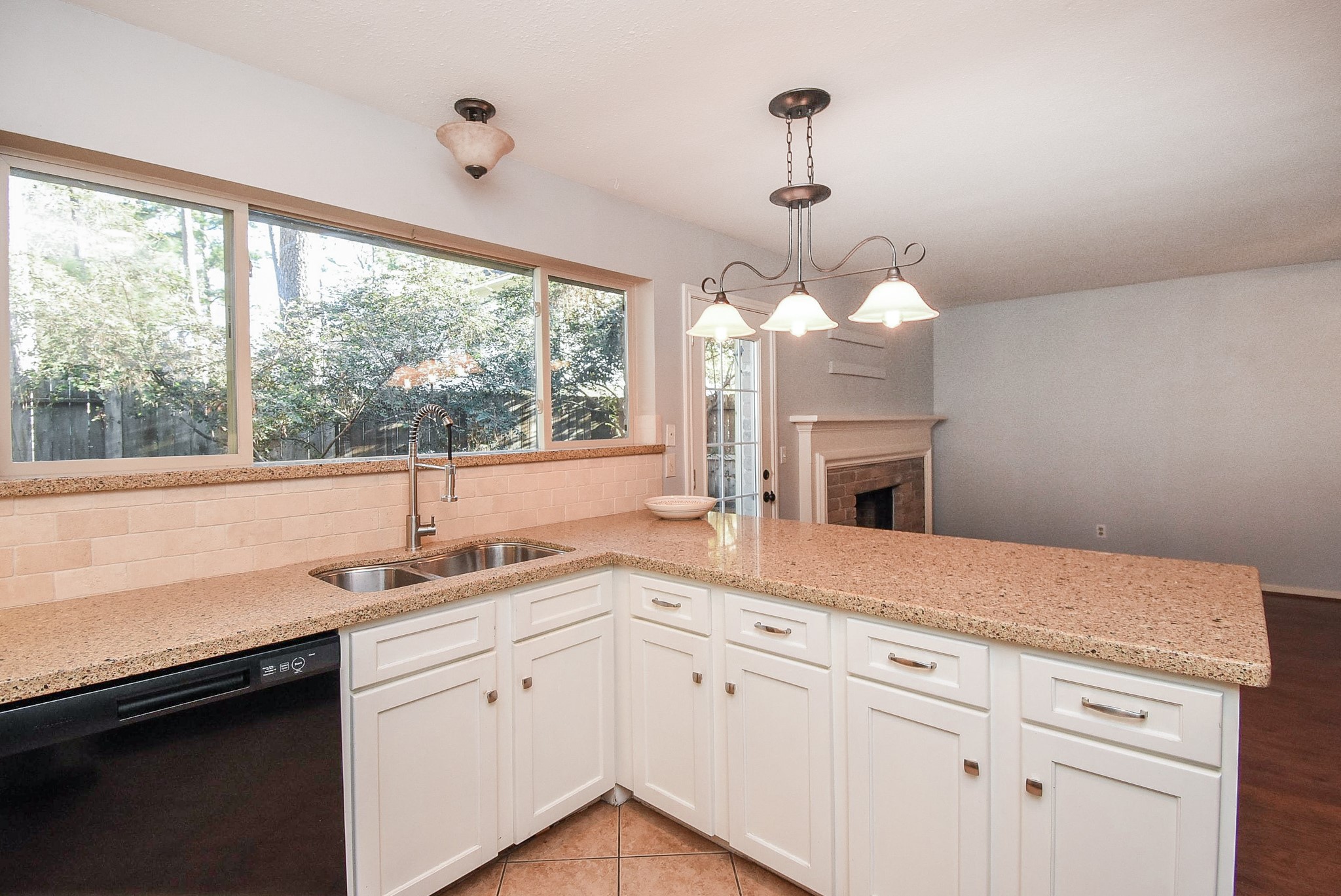 9107 Wallingham Court Spring, TX 77379 - Photo 14 of 25 a kitchen with a sink and large window