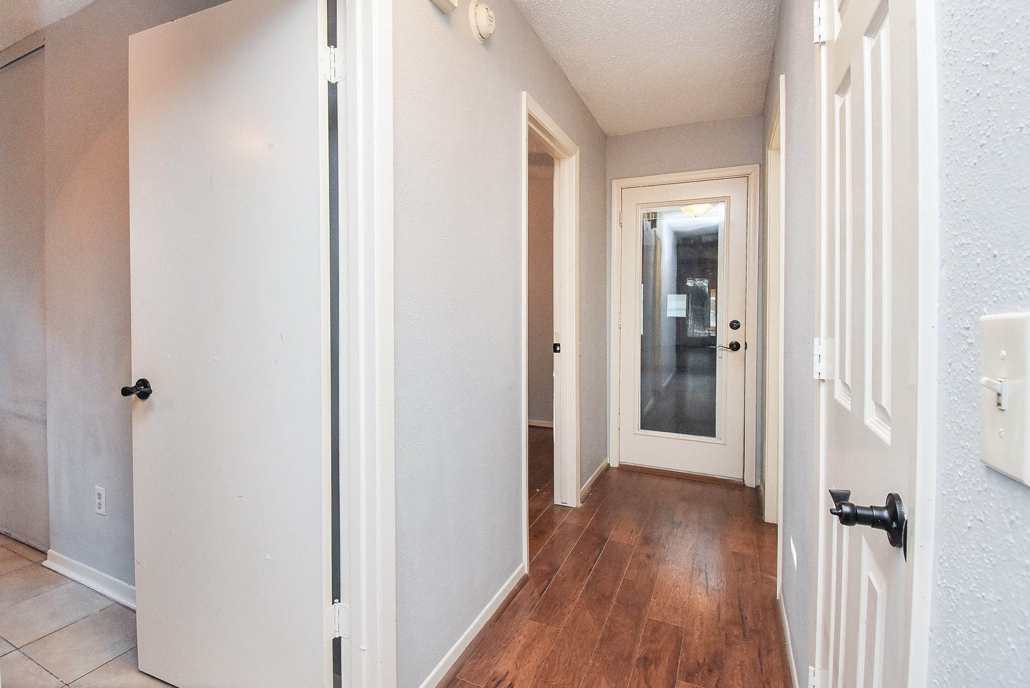 9107 Wallingham Court Spring, TX 77379 - Photo 15 of 25 a view of a hallway with wooden floor