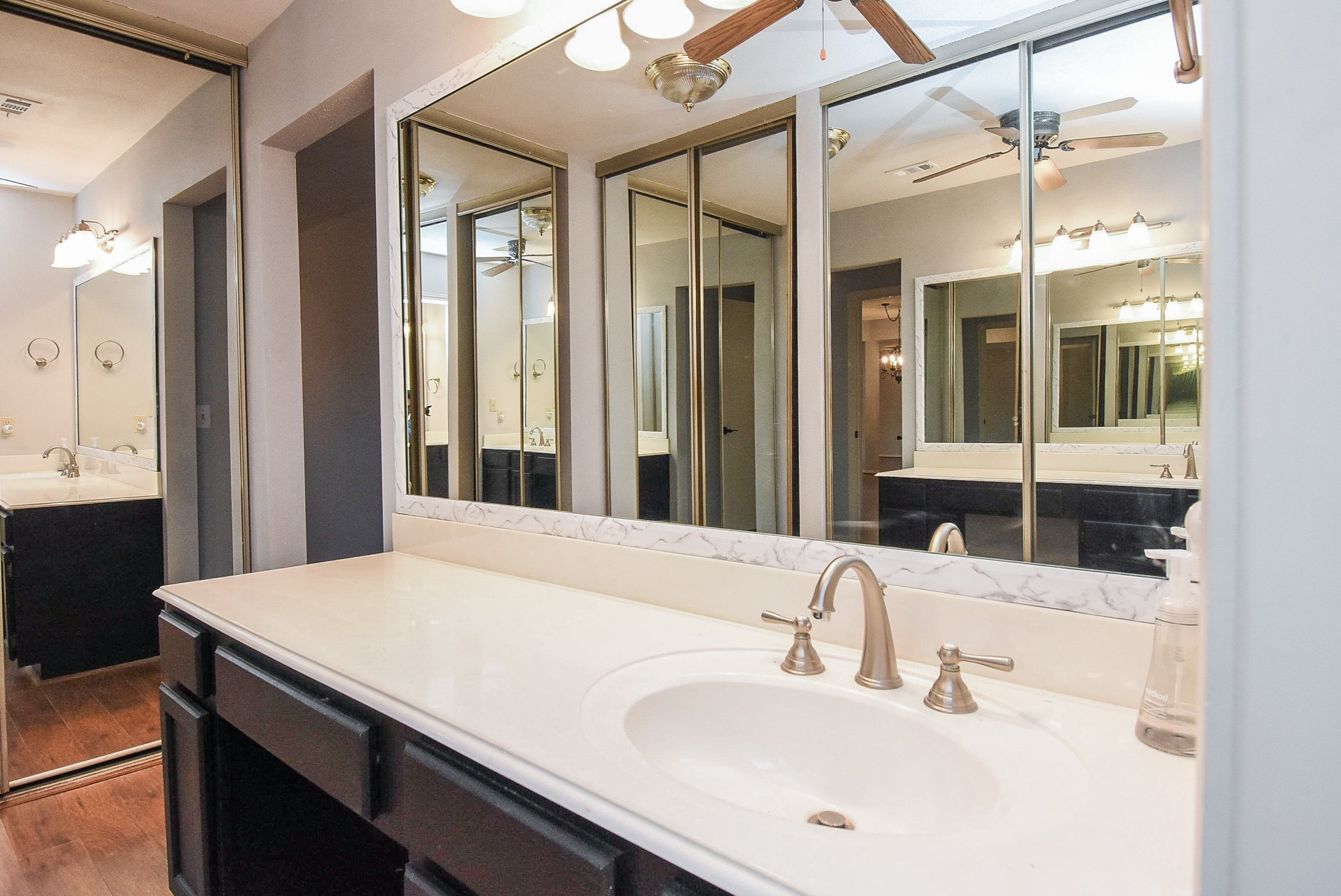 9107 Wallingham Court Spring, TX 77379 - Photo 18 of 25 a bathroom with a sink and a mirror