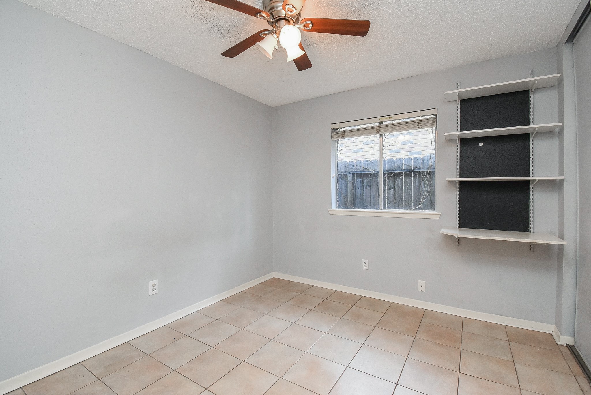 9107 Wallingham Court Spring, TX 77379 - Photo 20 of 25 a view of an empty room with a window